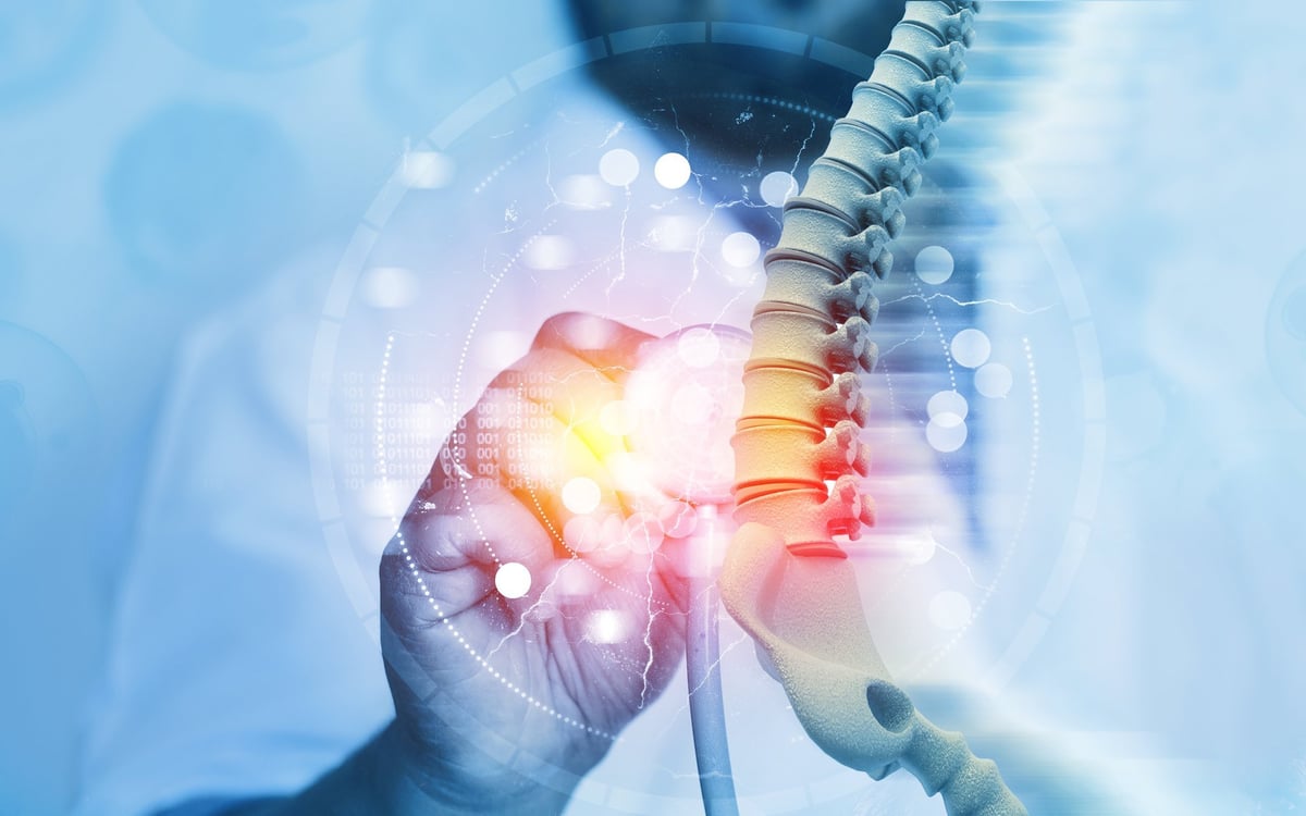 Doctor checking patient spine